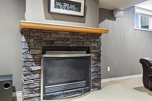 4012 Chatham Place Nw, Calgary, AB - Indoor Photo Showing Living Room With Fireplace