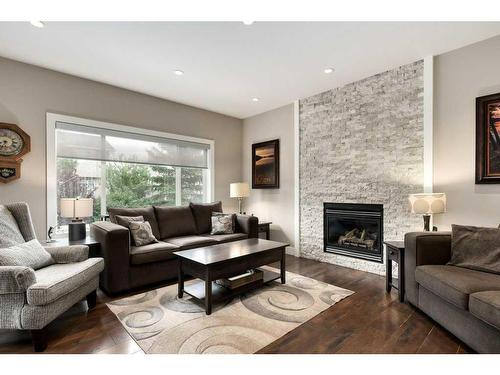 357 Wentworth Place Sw, Calgary, AB - Indoor Photo Showing Living Room With Fireplace