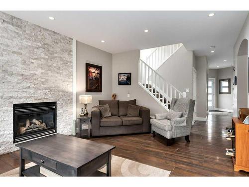 357 Wentworth Place Sw, Calgary, AB - Indoor Photo Showing Living Room With Fireplace