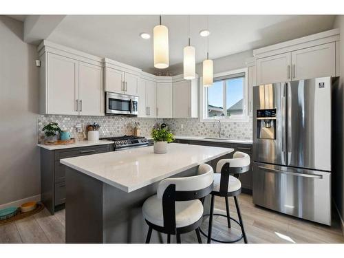 71 Wolf Creek Avenue Se, Calgary, AB - Indoor Photo Showing Kitchen With Upgraded Kitchen