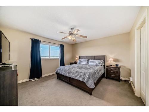 607 Hamptons Place Se, High River, AB - Indoor Photo Showing Bedroom