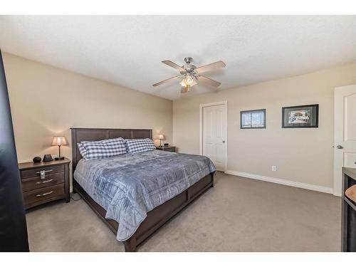 607 Hamptons Place Se, High River, AB - Indoor Photo Showing Bedroom