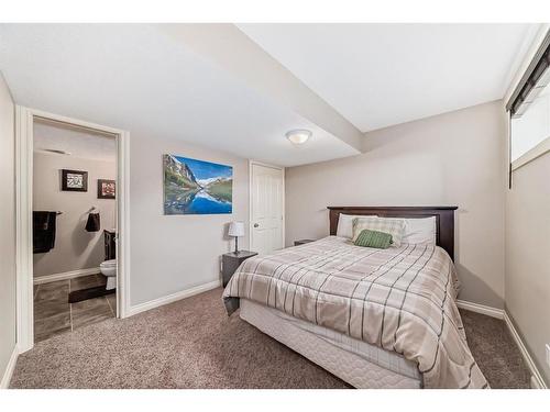 607 Hamptons Place Se, High River, AB - Indoor Photo Showing Bedroom