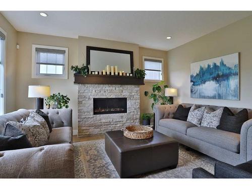 39 Prairie Smoke Rise, Rural Rocky View County, AB - Indoor Photo Showing Living Room With Fireplace