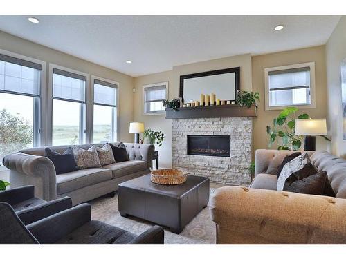 39 Prairie Smoke Rise, Rural Rocky View County, AB - Indoor Photo Showing Living Room With Fireplace