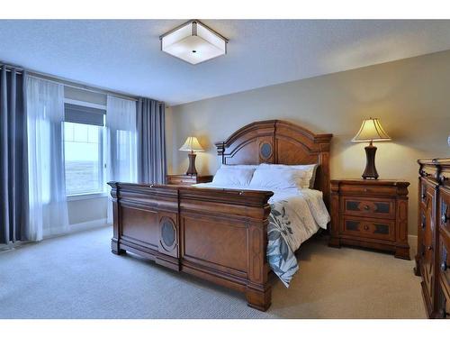 39 Prairie Smoke Rise, Rural Rocky View County, AB - Indoor Photo Showing Bedroom