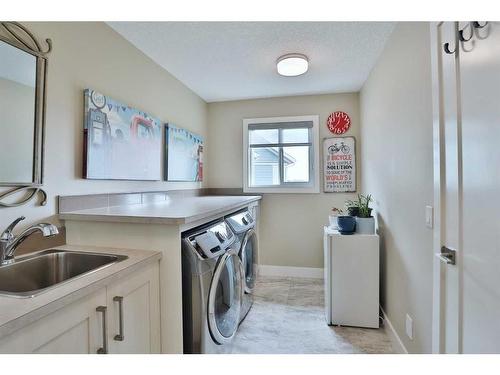 39 Prairie Smoke Rise, Rural Rocky View County, AB - Indoor Photo Showing Laundry Room