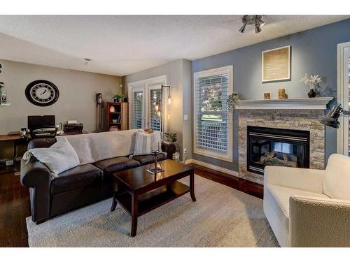 117 Hidden Creek Gardens Nw, Calgary, AB - Indoor Photo Showing Living Room With Fireplace