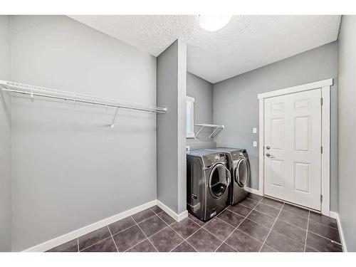 9 Sherwood Street Nw, Calgary, AB - Indoor Photo Showing Laundry Room