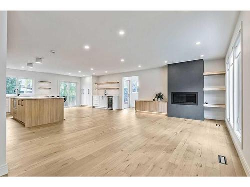 404 Canterbury Place Sw, Calgary, AB - Indoor Photo Showing Other Room With Fireplace