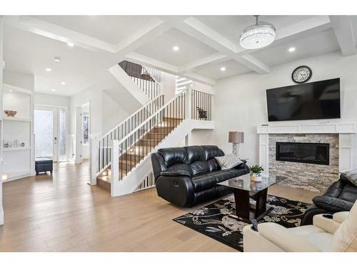 1476 Coopers Landing Sw, Airdrie, AB - Indoor Photo Showing Living Room With Fireplace