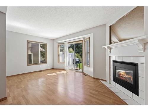 1324 154 Avenue Sw, Calgary, AB - Indoor Photo Showing Living Room With Fireplace