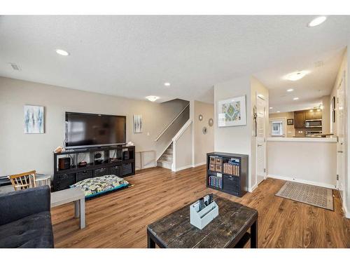 517-2400 Ravenswood View Se, Airdrie, AB - Indoor Photo Showing Living Room