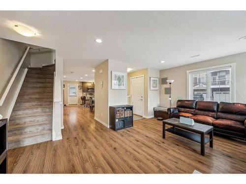 517-2400 Ravenswood View Se, Airdrie, AB - Indoor Photo Showing Living Room