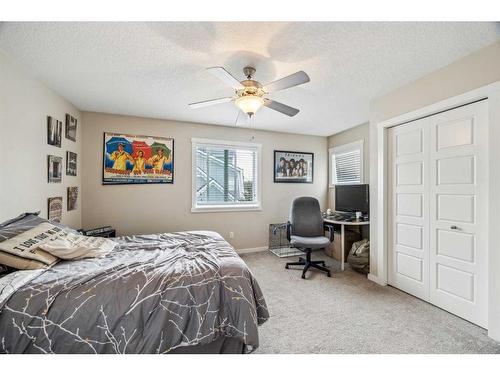 517-2400 Ravenswood View Se, Airdrie, AB - Indoor Photo Showing Bedroom