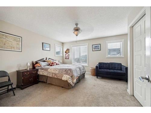 517-2400 Ravenswood View Se, Airdrie, AB - Indoor Photo Showing Bedroom