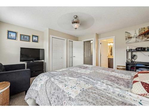 517-2400 Ravenswood View Se, Airdrie, AB - Indoor Photo Showing Bedroom