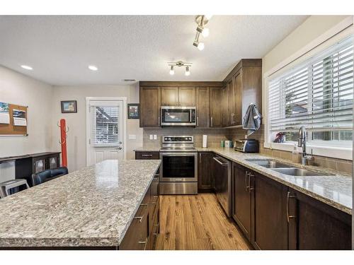 517-2400 Ravenswood View Se, Airdrie, AB - Indoor Photo Showing Kitchen With Stainless Steel Kitchen With Double Sink With Upgraded Kitchen