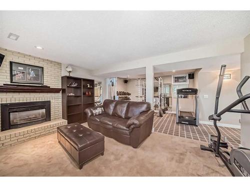 248 Nottingham Road Nw, Calgary, AB - Indoor Photo Showing Living Room With Fireplace