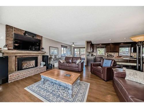 248 Nottingham Road Nw, Calgary, AB - Indoor Photo Showing Living Room With Fireplace