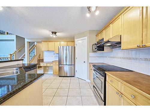 119 Cougar Ridge Drive Sw, Calgary, AB - Indoor Photo Showing Kitchen With Double Sink