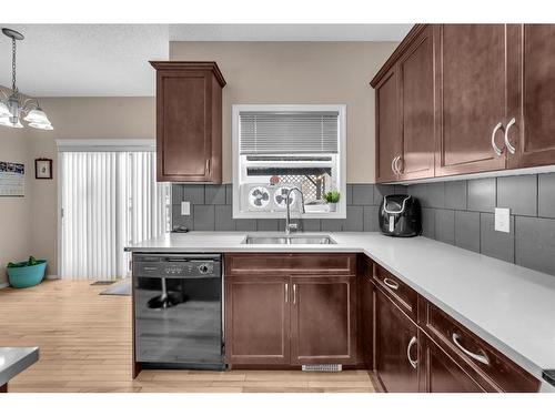 288 Saddlecrest Way Ne, Calgary, AB - Indoor Photo Showing Kitchen With Double Sink