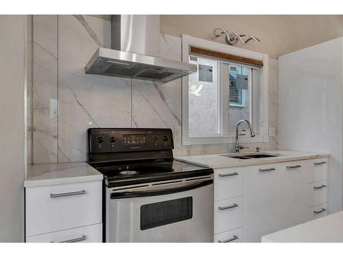 97 Shawinigan Drive Sw, Calgary, AB - Indoor Photo Showing Kitchen With Double Sink