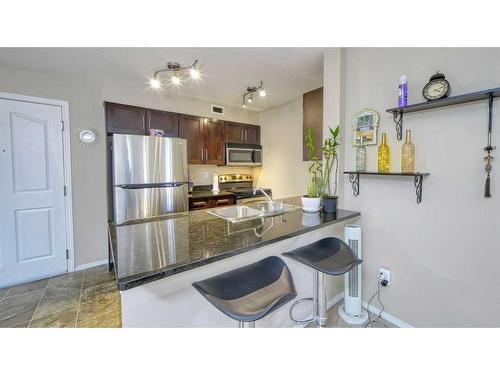 122-355 Taralake Way Ne, Calgary, AB - Indoor Photo Showing Kitchen With Stainless Steel Kitchen With Double Sink