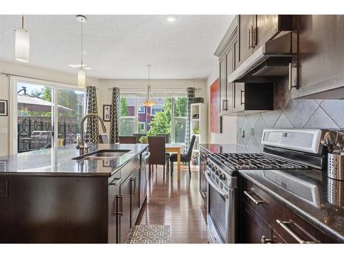 393 River Heights Drive, Cochrane, AB - Indoor Photo Showing Kitchen With Double Sink With Upgraded Kitchen