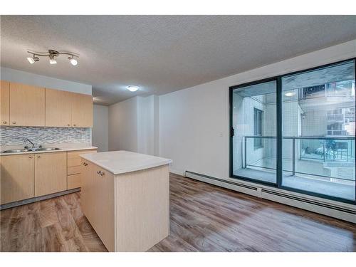 311-1111 6 Avenue Sw, Calgary, AB - Indoor Photo Showing Kitchen With Double Sink