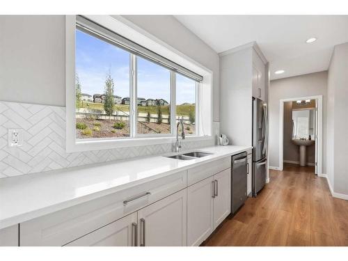 246 Sage Meadows Green Nw, Calgary, AB - Indoor Photo Showing Kitchen With Double Sink