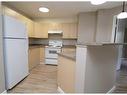 8119-304 Mackenzie Way Sw, Airdrie, AB  - Indoor Photo Showing Kitchen 