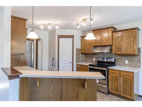 48 Eversyde Manor Sw, Calgary, AB - Indoor Photo Showing Kitchen With Upgraded Kitchen