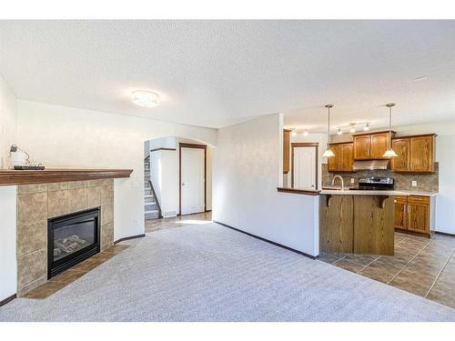 48 Eversyde Manor Sw, Calgary, AB - Indoor With Fireplace