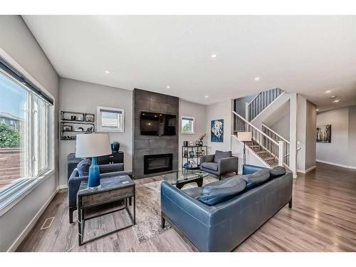 572 Chinook Gate Square Sw, Airdrie, AB - Indoor Photo Showing Living Room With Fireplace