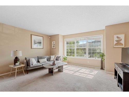 286 Tuscany Springs Boulevard Nw, Calgary, AB - Indoor Photo Showing Living Room