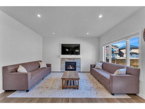 57 Saddlestone Green Ne, Calgary, AB - Indoor Photo Showing Living Room With Fireplace