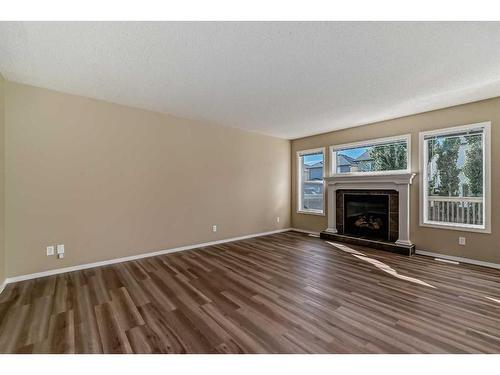 273 New Brighton Lane Se, Calgary, AB - Indoor Photo Showing Living Room With Fireplace