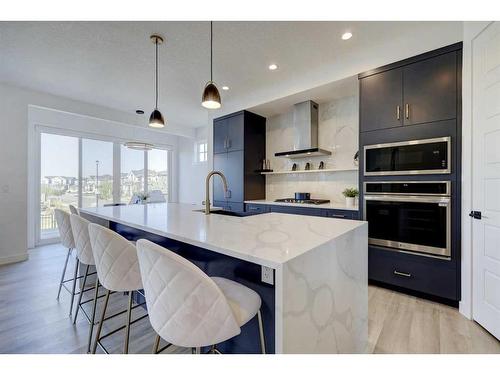 3 Lawrence Green Se, Airdrie, AB - Indoor Photo Showing Kitchen With Upgraded Kitchen