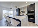 3 Lawrence Green Se, Airdrie, AB  - Indoor Photo Showing Kitchen With Upgraded Kitchen 