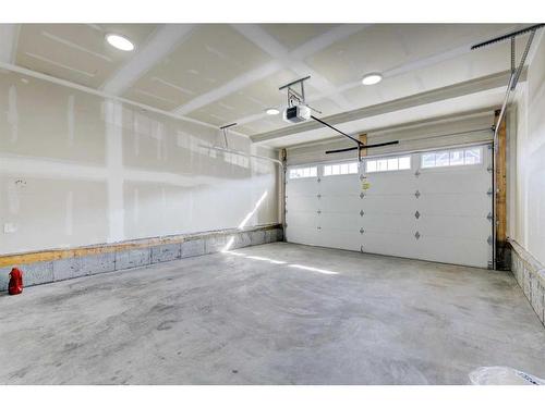 3 Lawrence Green Se, Airdrie, AB - Indoor Photo Showing Garage