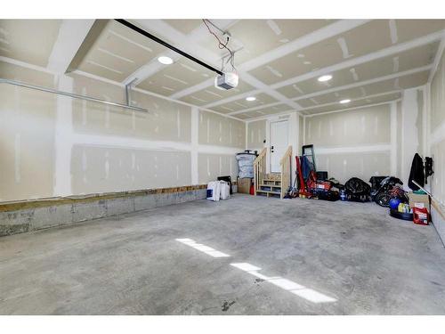 3 Lawrence Green Se, Airdrie, AB - Indoor Photo Showing Garage