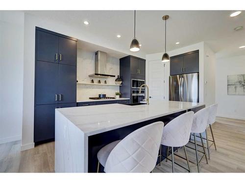 3 Lawrence Green Se, Airdrie, AB - Indoor Photo Showing Kitchen With Upgraded Kitchen