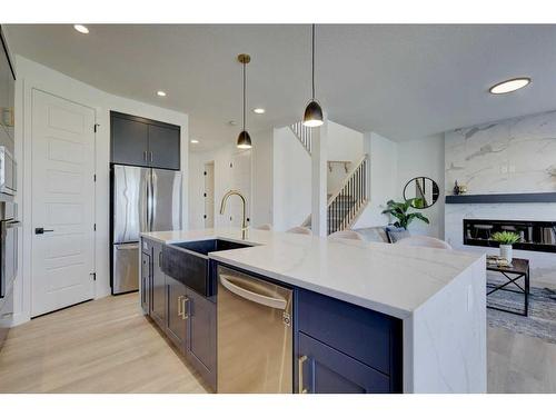 3 Lawrence Green Se, Airdrie, AB - Indoor Photo Showing Kitchen With Upgraded Kitchen