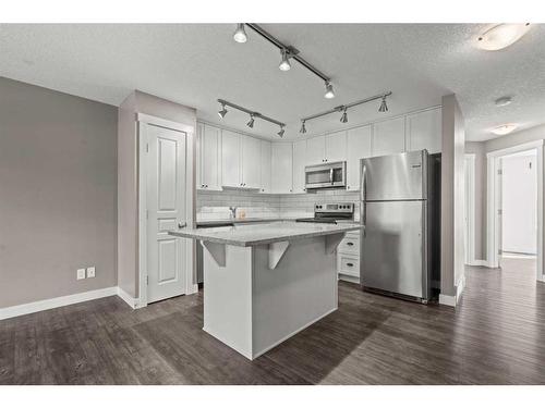 650 Cranford Walk Se, Calgary, AB - Indoor Photo Showing Kitchen With Upgraded Kitchen