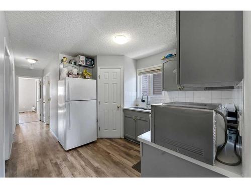 163 Taravista Drive Ne, Calgary, AB - Indoor Photo Showing Kitchen With Double Sink