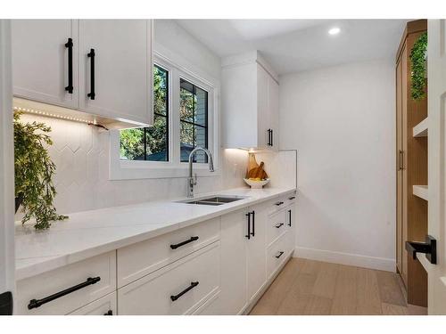 42 Canova Road Sw, Calgary, AB - Indoor Photo Showing Kitchen With Double Sink