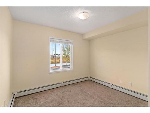 6102-304 Mackenzie Way Sw, Airdrie, AB - Indoor Photo Showing Other Room