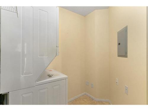 6102-304 Mackenzie Way Sw, Airdrie, AB - Indoor Photo Showing Laundry Room