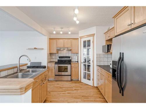 89 Cramond Crescent Se, Calgary, AB - Indoor Photo Showing Kitchen With Double Sink